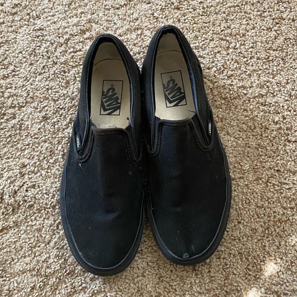 All black slip-on vans